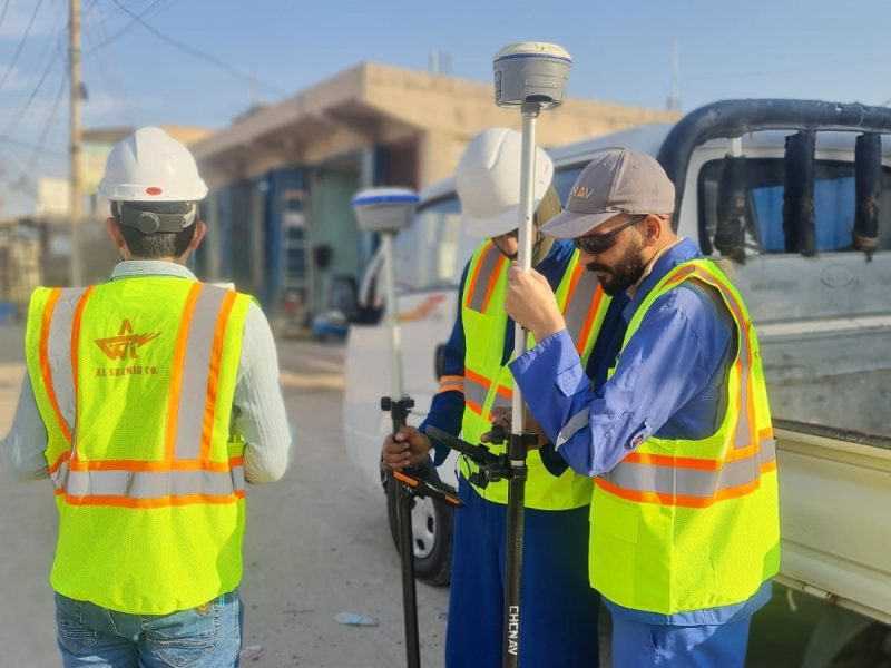 Survey team setting out street alignment with CHCNAV GNSS/RTK equipment.