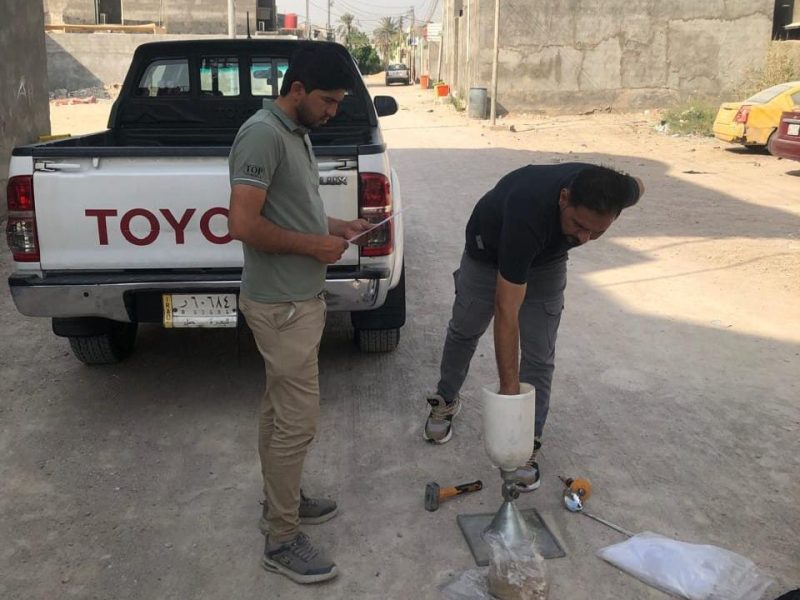 Al Shamsh QC engineers performing a field sand-cone density test on the compacted base.
