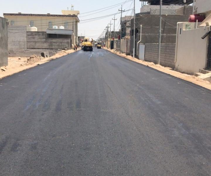 Completed asphalt street in a residential neighbourhood.